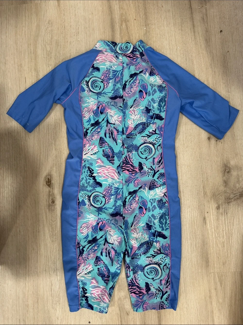 Coolibar toddler girl neck to knee Blue Seashell Print Zip-Front swimwuit